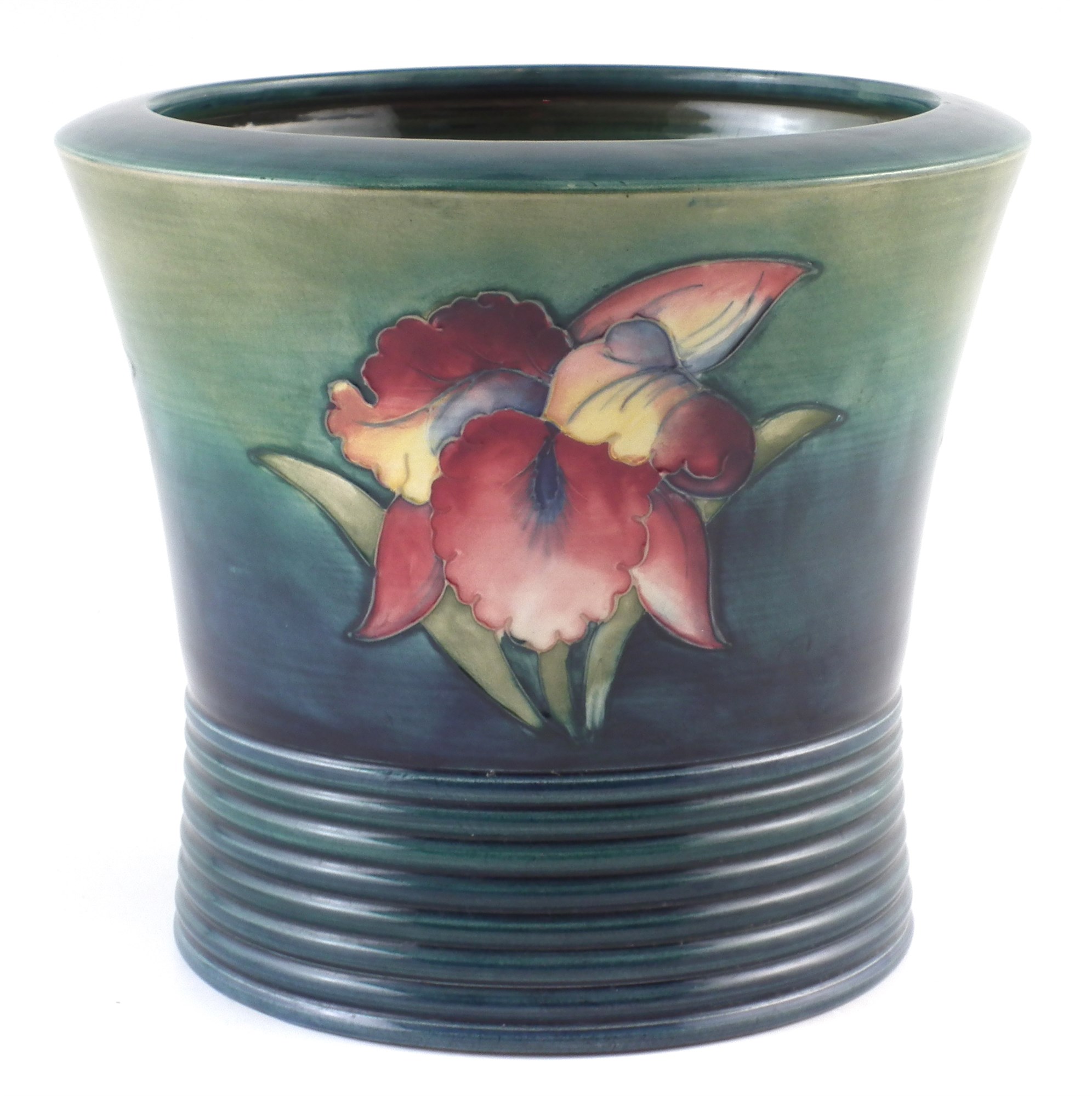 Moorcroft jardinière , decorated with orchid pattern 19cm high For a condition report please visit