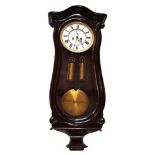 A 19th century double weight mahogany Vienna regulator. The serpentine case has rounded arched