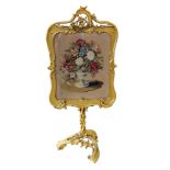 Victorian gesso fire-screen, rectangular frame supporting needlepoint tapestry depicting flowers