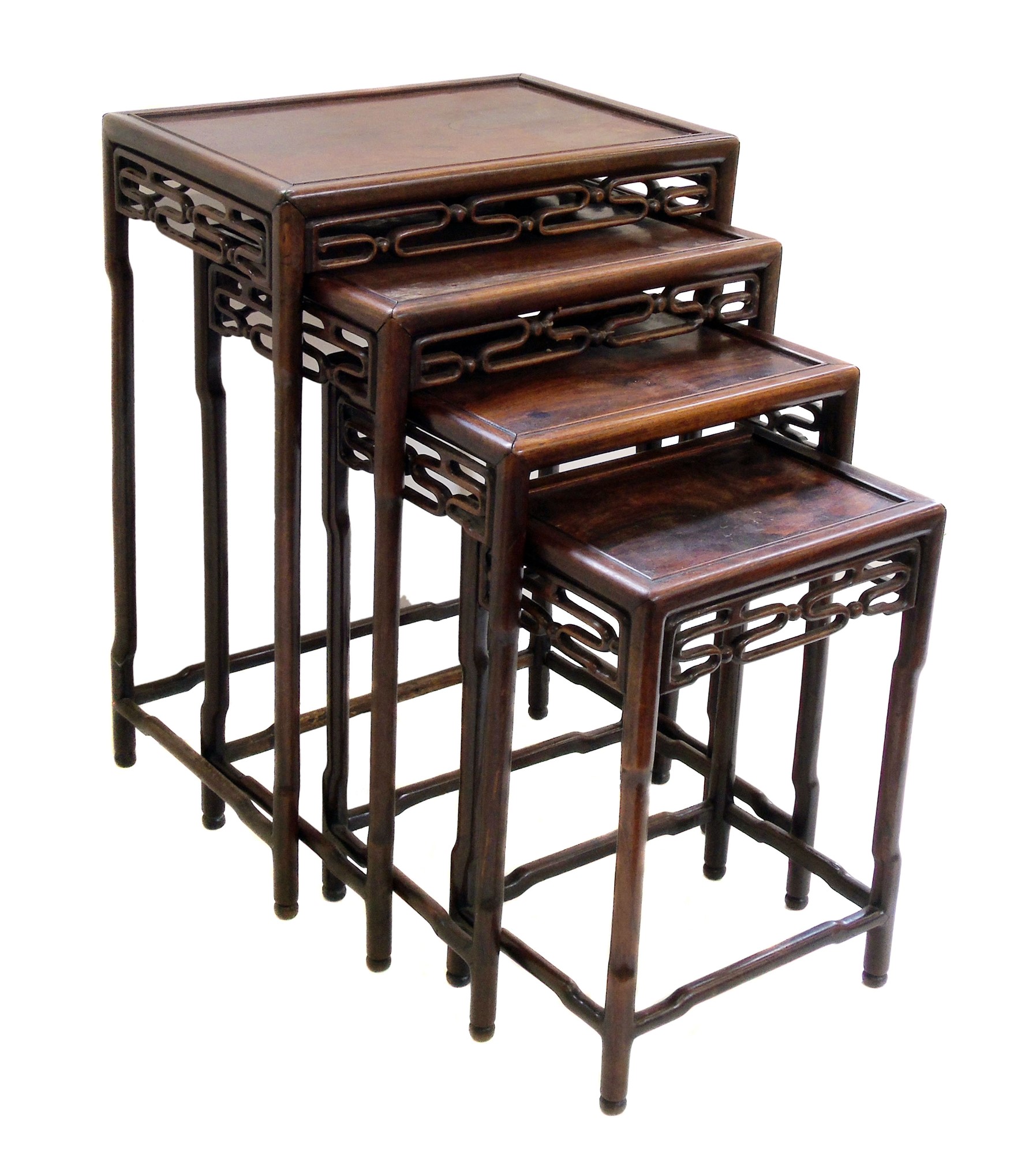 Early 20th century rosewood nest of four tables, each with rectangular top, fretwork frieze,