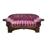 19th century Biedermeier style sofa, arched back with figured mahogany veneers, scrolling arms