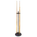 Three cues and cue rest contained in snooker cue stand, height 112cm (44"). For a condition report
