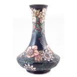 Moorcroft vase decorated with Carousel pattern after Rachel Bishop, Numbered 727, marked as a