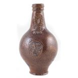 German stoneware Bellarmine jug, with masked neck, decorated with speckled brown glaze, 17th