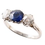 Sapphire and diamond three-stone platinum ring , central round brilliant cut sapphire measuring