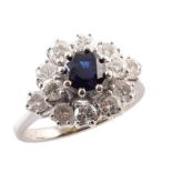 Sapphire and diamond 18ct white gold cluster ring , central round brilliant cut sapphire measuring