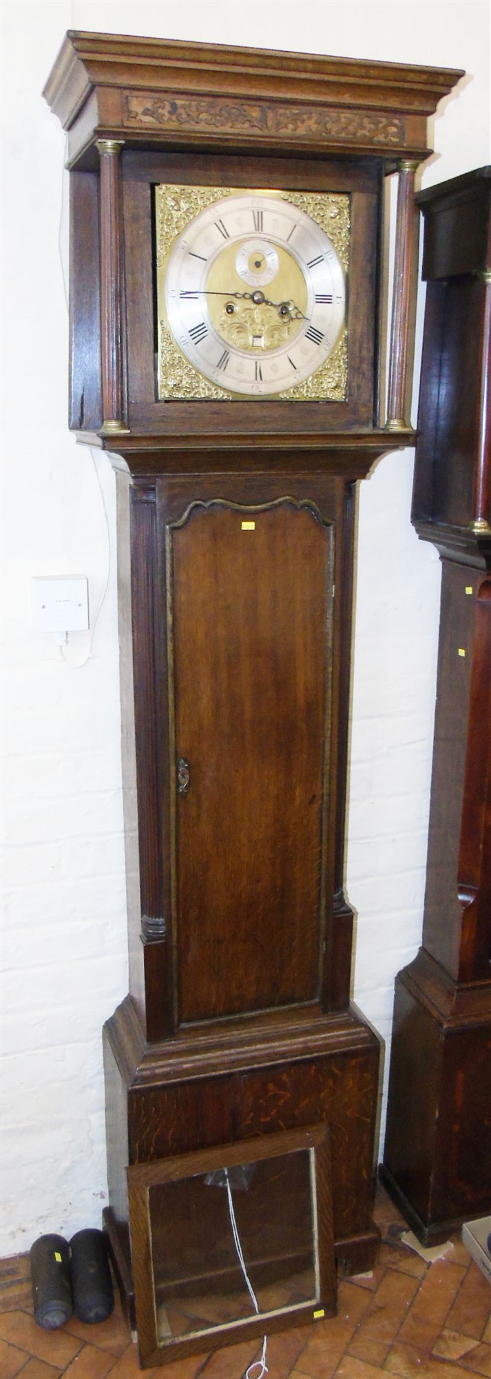 An early 18th century oak longcase clock Condition reports are not available for our Interiors