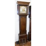 An early 18th century oak longcase clock Condition reports are not available for our Interiors
