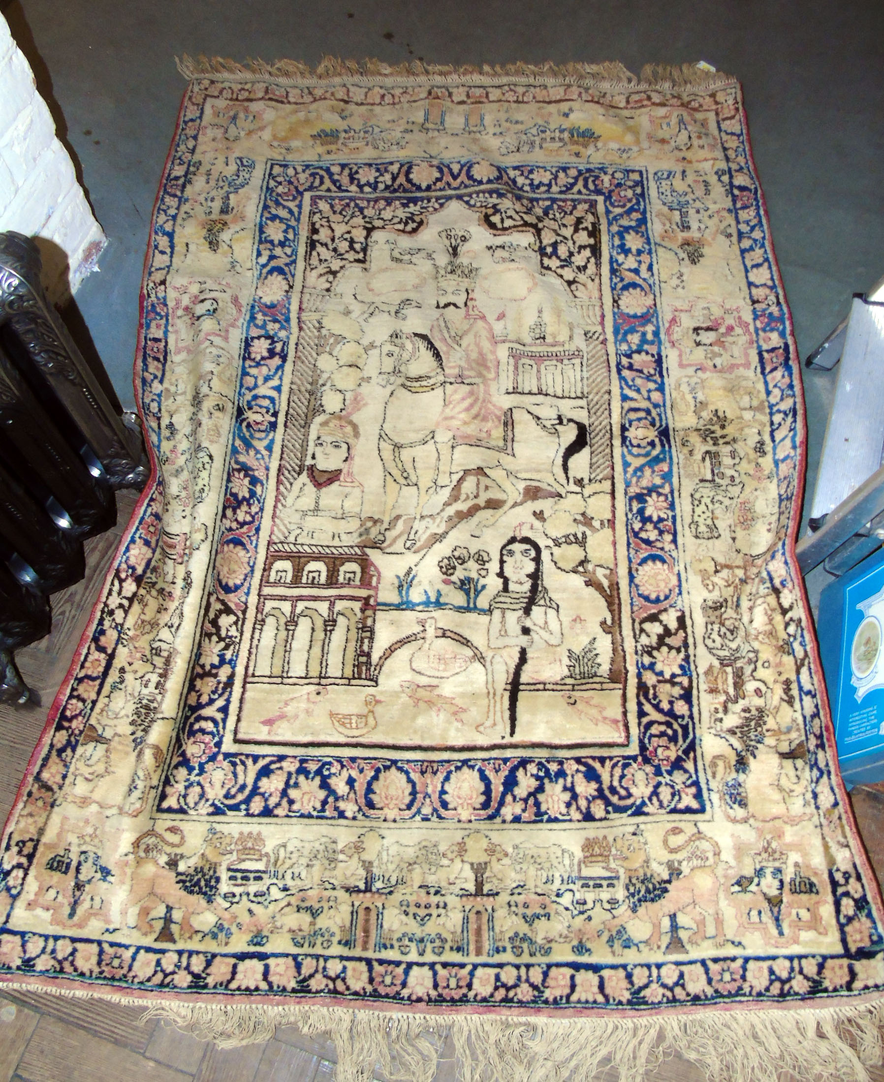 Persian rug with wall hangings depicting Rustam on horseback 172cm X ...