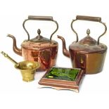 Two copper kettles with acorn finials, brass pestle and mortar and copper tea pot stand with green
