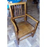 George III oak and elm open arm chair. Condition reports are not available for our Interiors Sales.