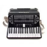 72 key bass accordion, model 272 EE, numbered 415 2 with strap and case which measures 54cm wide