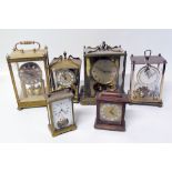 Six assorted brass table clocks including four torsion clocks Condition reports are not available