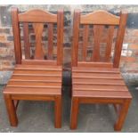 A pair of hardwood dining chairs Condition reports are not available for our Interiors Sales.