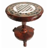 An early 19th century rosewood circular games table,