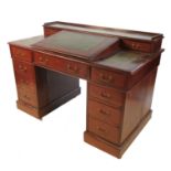 A 19th century twin pedestal desk, with central rising slope, having three frieze drawers below,