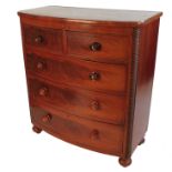 A 19th century mahogany bow fronted chest, of two short drawers over three long drawers,