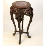 A late 19th century octagonal padouk wood jardiniere stand, with inset marble top,