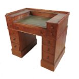 An oak twin pedestal desk, with recessed writing slope, raised on two pedestals of three drawers,