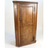 A 19th century oak painted corner cupboard,