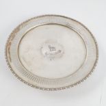 A silver circular pedestal dish, with pierced border,