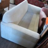 A modern scroll end sofa, in beige upholstery,