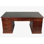 A mahogany partners desk, fitted three frieze drawers, over two banks of drawers,