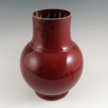 A Sang de Boeuf Chinese bulbous bodied vase, height 12.