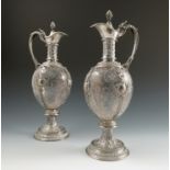 A pair of SY & Wagner Berlin silver and glass ewers, the silver hinged cover, neck,