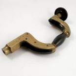 A brass framed lever pad ebony brace,