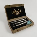A boxed The Long Life three piece propelling pencil set,