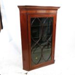 A 19th century glazed mahogany corner cupboard, the door opening to reveal shelves, width 30.