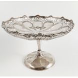 A silver comport, with pierced shaped edge, the centre with presentation inscription,