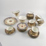 A Royal Worcester part tea service, the centre decorated with floral sprays,