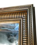 A large rectangular gilt frame wall mirror,