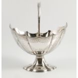 A Victorian silver oval basket, with shaped body and edge,