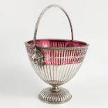 A Victorian silver basket, with beaded swing handle, the pierced and reeded body,