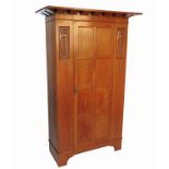 An Arts and Crafts oak wardrobe,