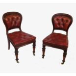 A set of six mahogany dining chairs, with deep button leather backs and seats,