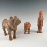 Three terracotta funereal figures Condition report: Large dog figure has broken leg,