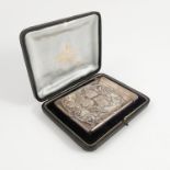 A cased silver card case, embossed with four cherub heads and scrolls, London 1899,