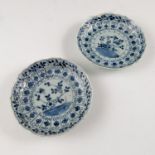 A pair of Chinese saucers, decorated with flowers,