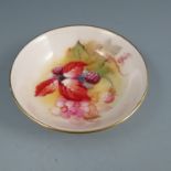 A Royal Worcester circular pin dish, hand painted with autumn berries and leaves, signed K Blake,