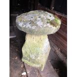 A staddle stone and cap