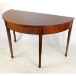 A 19th century mahogany D end extending dining table, with central section and two leaves,