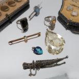 A collection of jewellery, including a large citrine pendant, a cased opal bar brooch,