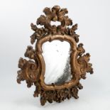 An ornate gilt framed wall mirror, overall dimensions,