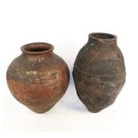 Two pottery olive jars,