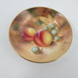 A Royal Worcester pin dish, decorated with fruit to a mossy background by Roberts, diameter 3.
