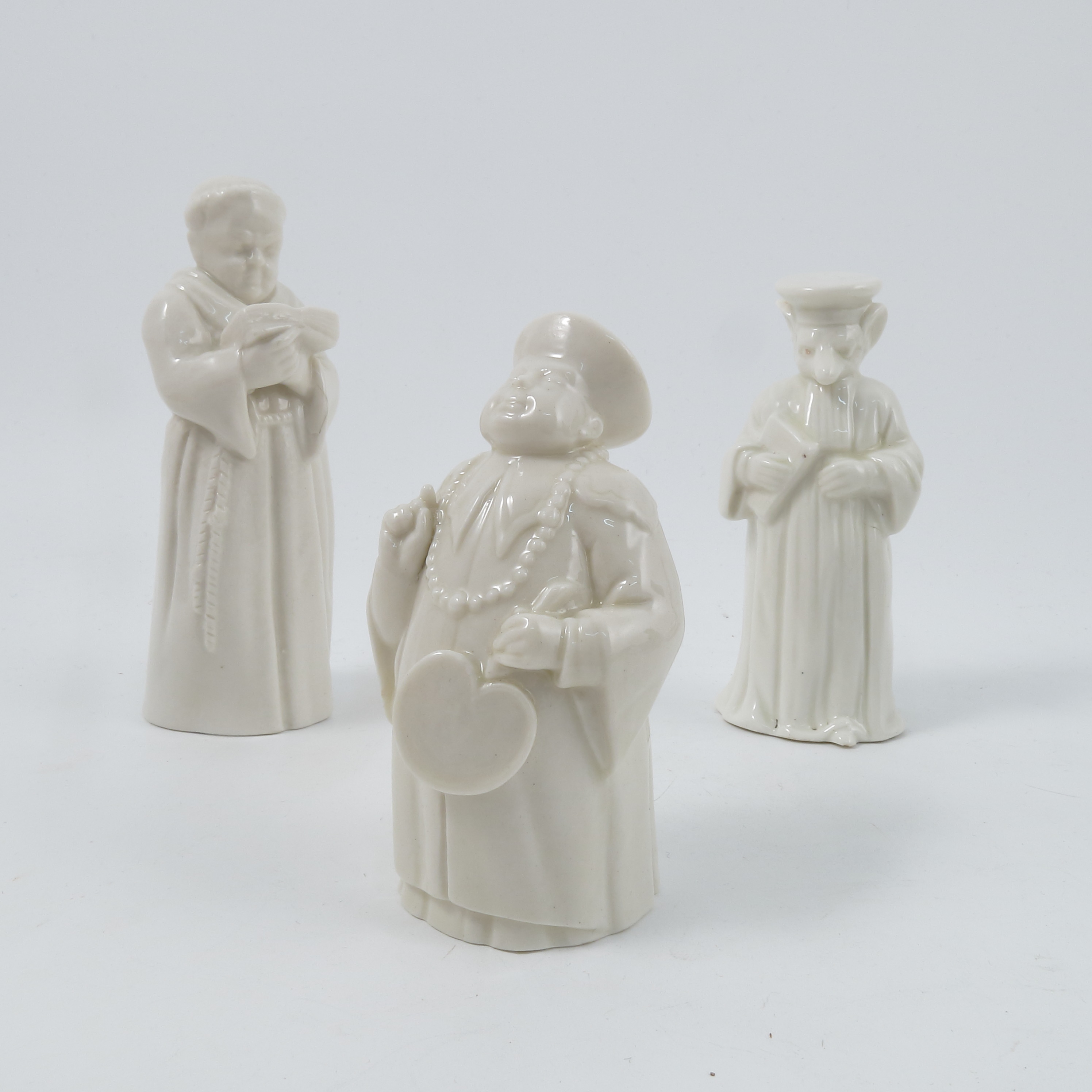 Three Royal Worcester candle snuffers, unusually left in the white, comprising Mandarin,